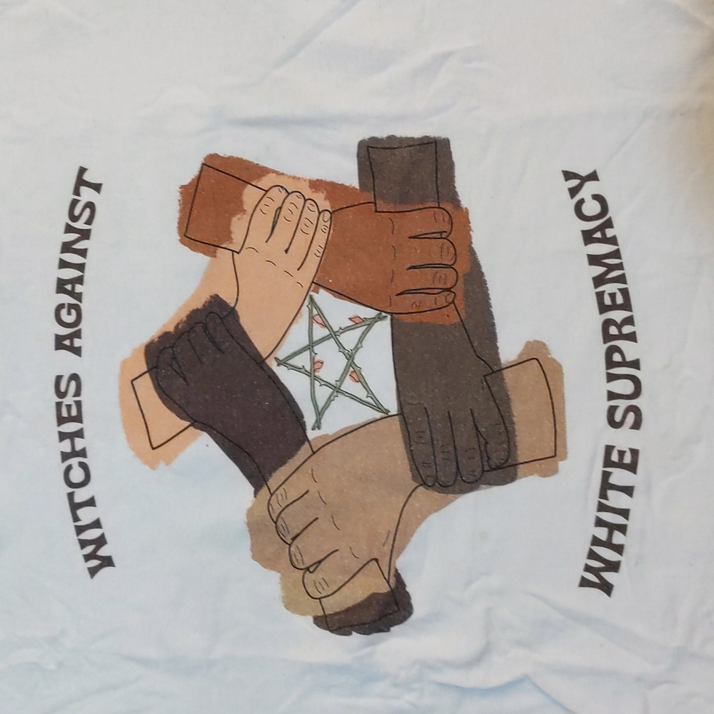 Which is against white supremacy art print tee, adult size medium